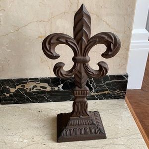 Fleur de lis:Bronze colored metal sculpture.